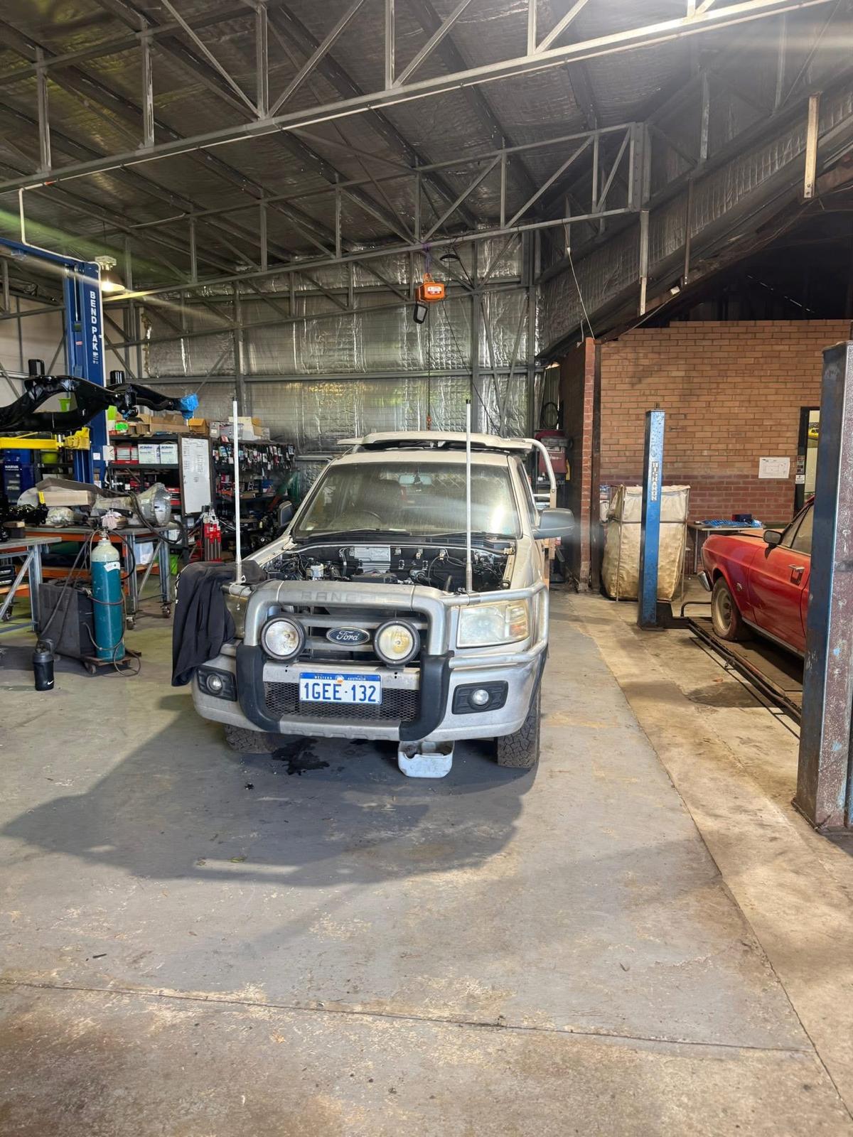 Workshop interior with vehicles being serviced